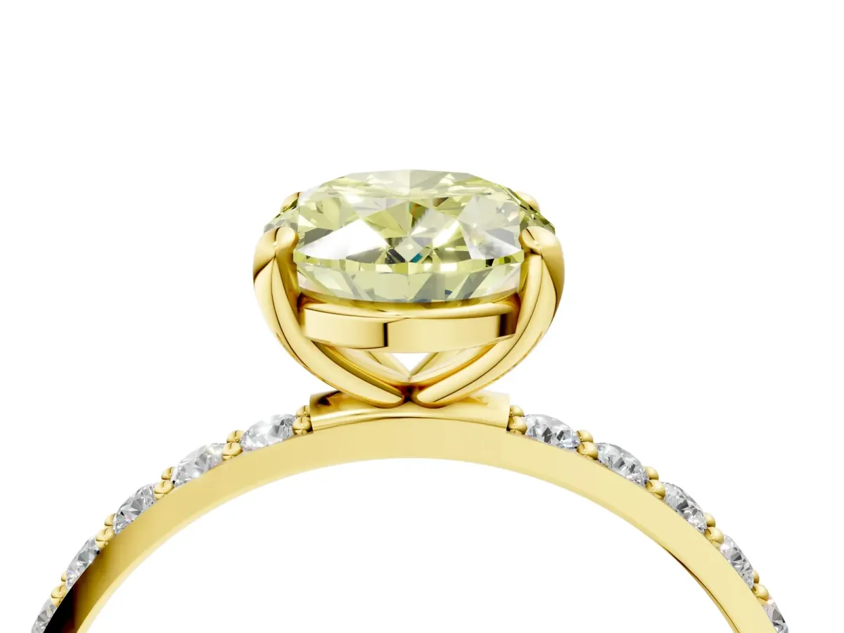 Fancy Yellow Oval Cut Diamond Solitaire Ring with Round Pavé Band and Prong Setting Yellow gold