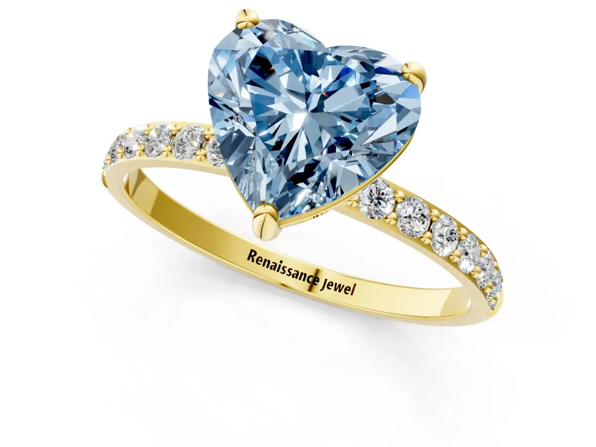 Fancy Blue Heart Cut Diamond Solitaire Ring with Round Pavé Band and Prong Setting Yellow gold