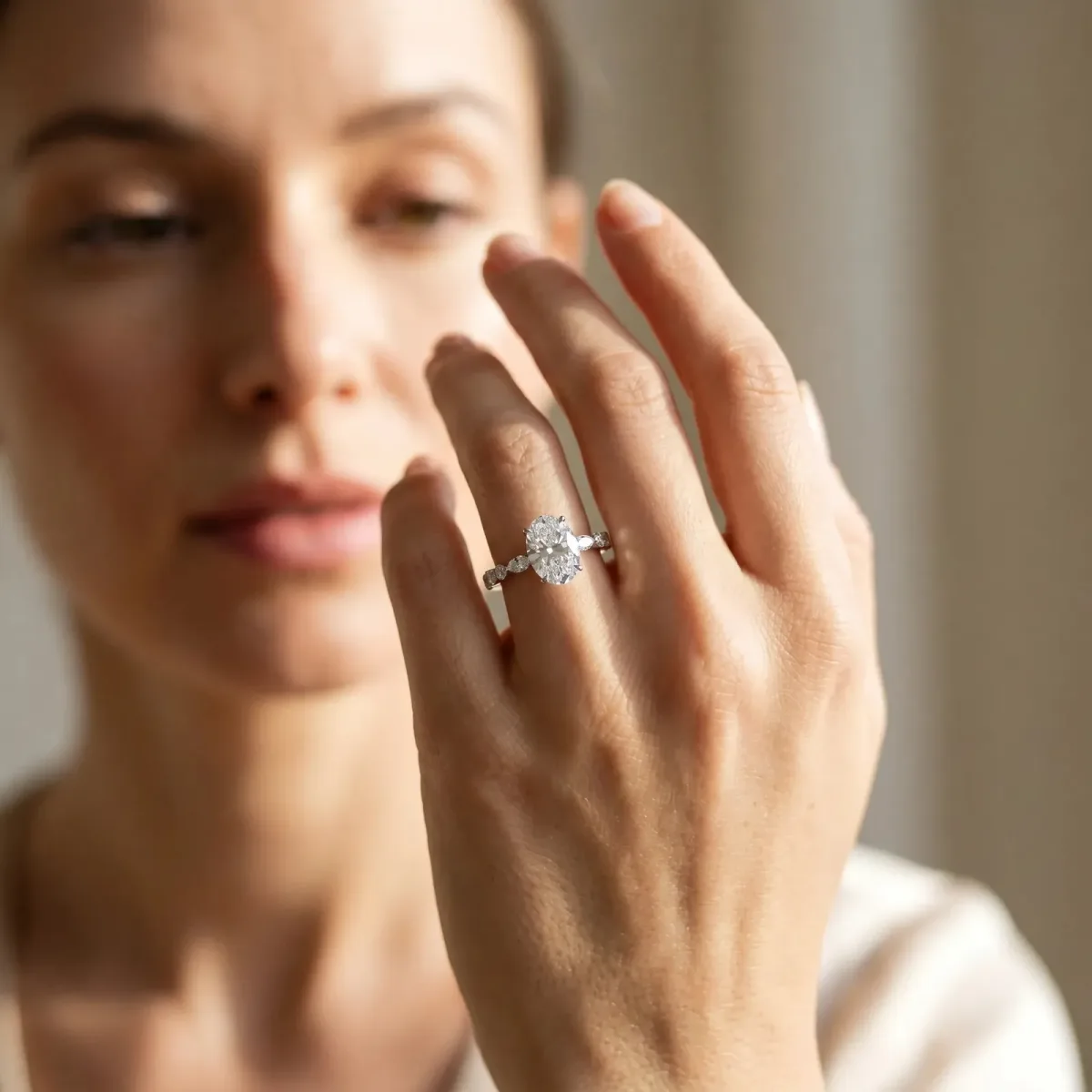 Oval Cut Diamond Ring with Marquise and Round Side Stones and Four-Prong Setting Silver