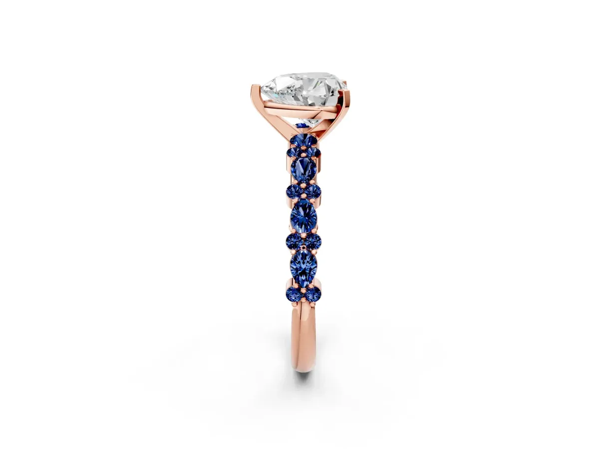 Heart Cut Diamond Side Stone Solitaire Ring with Round Blue Sapphire and Four-Prong Setting Rose gold