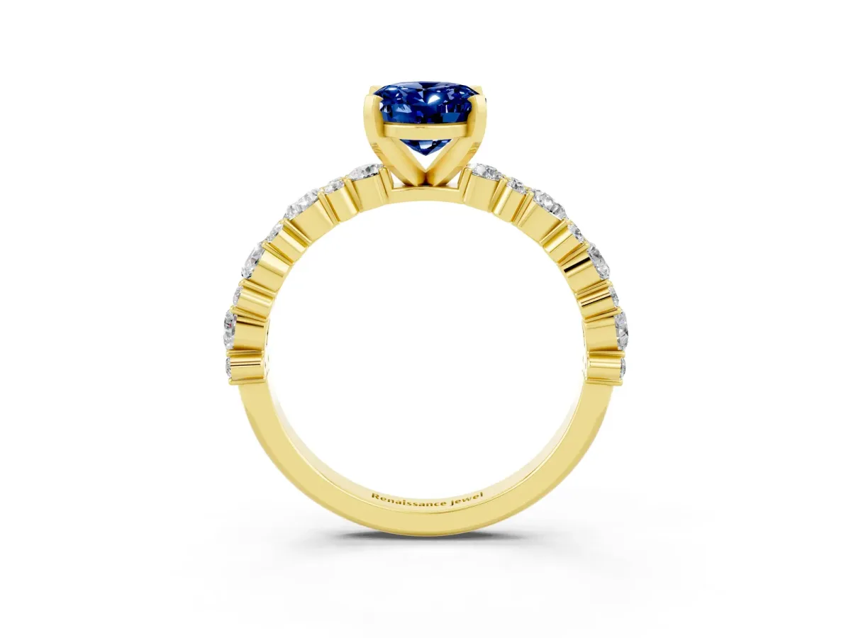 Oval Cut Blue Sapphire Side Stone Solitaire Ring with Round and Four-Prong Setting Yellow gold