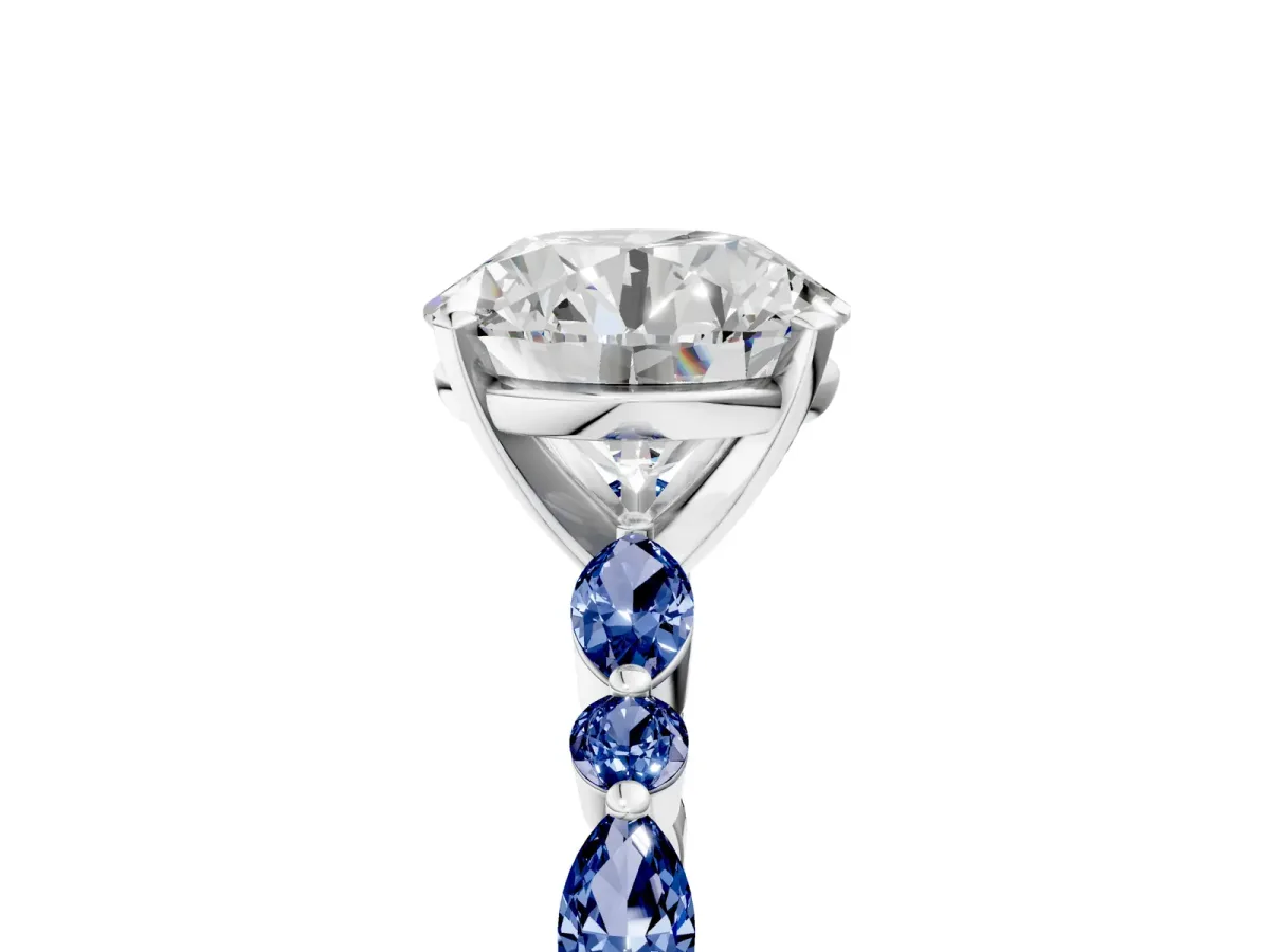 Round Cut Diamond Ring with Marquise and Round Blue Sapphire Side Stones and Four-Prong Setting Silver