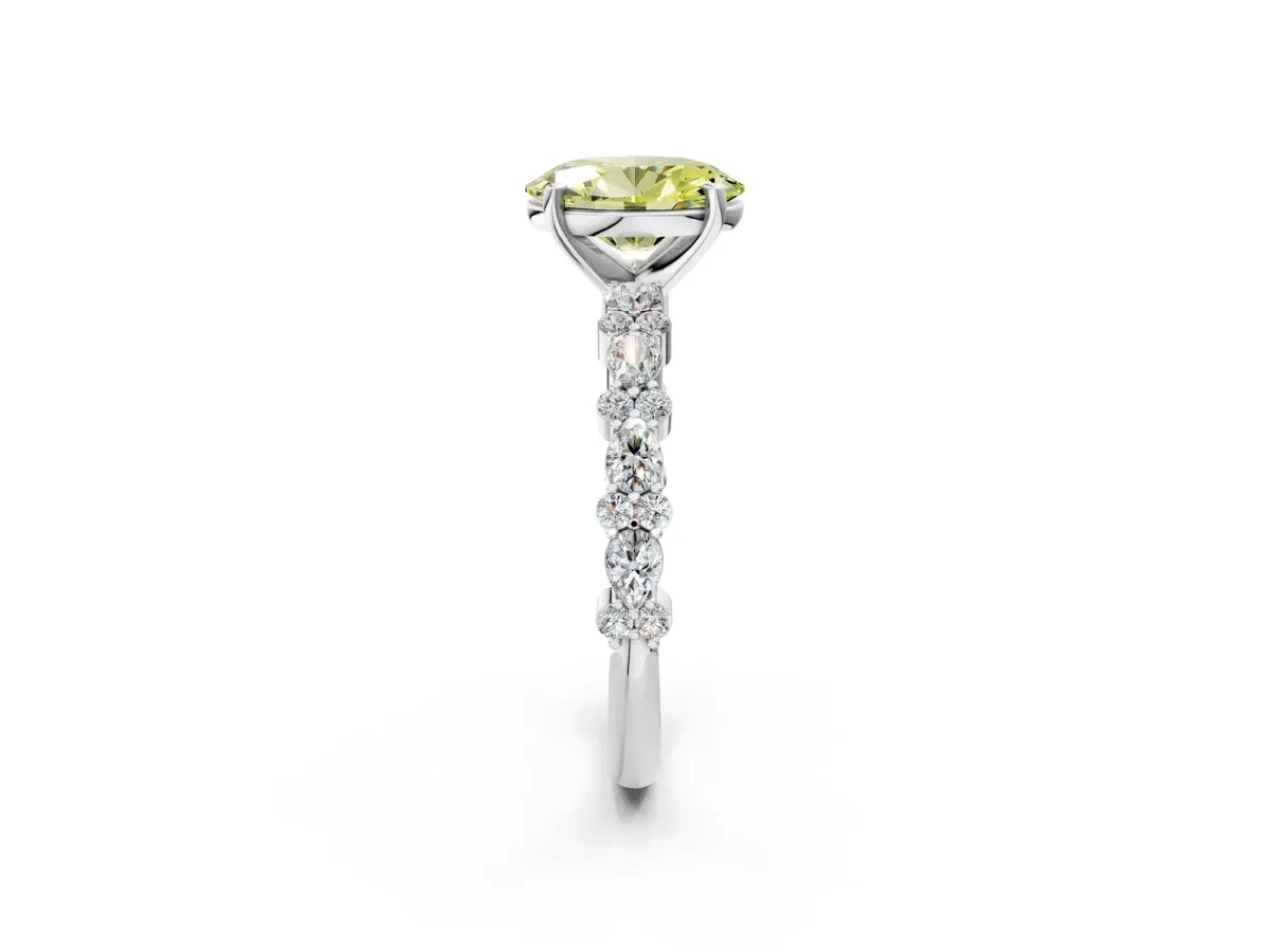 Fancy Yellow Oval Cut Diamond Side Stone Solitaire Ring with Round and Four-Prong Setting Platinum