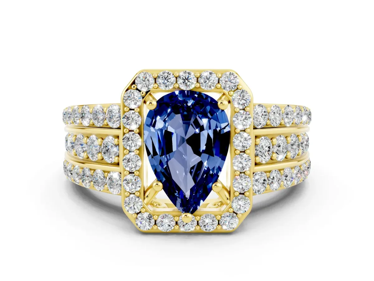 Pear Cut Halo Blue Sapphire Ring with Round Split Shank and Prong Setting Yellow gold