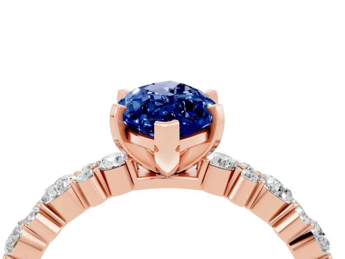 Marquise Cut Blue Sapphire Side Stone Solitaire Ring with Round and Four-Prong Setting Rose gold
