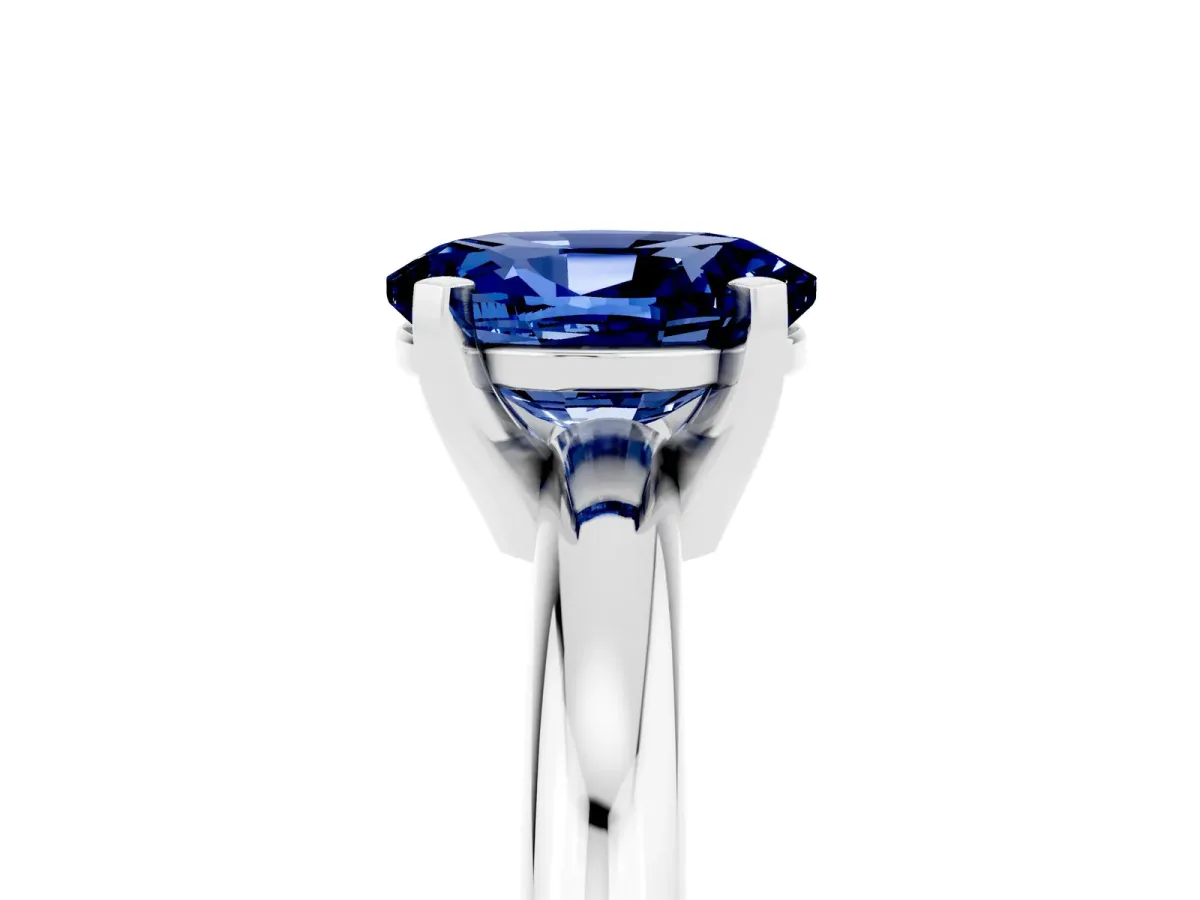 Oval Cut Blue Sapphire Solitaire Engagement Ring with Round Band and Four-Prong Setting Silver