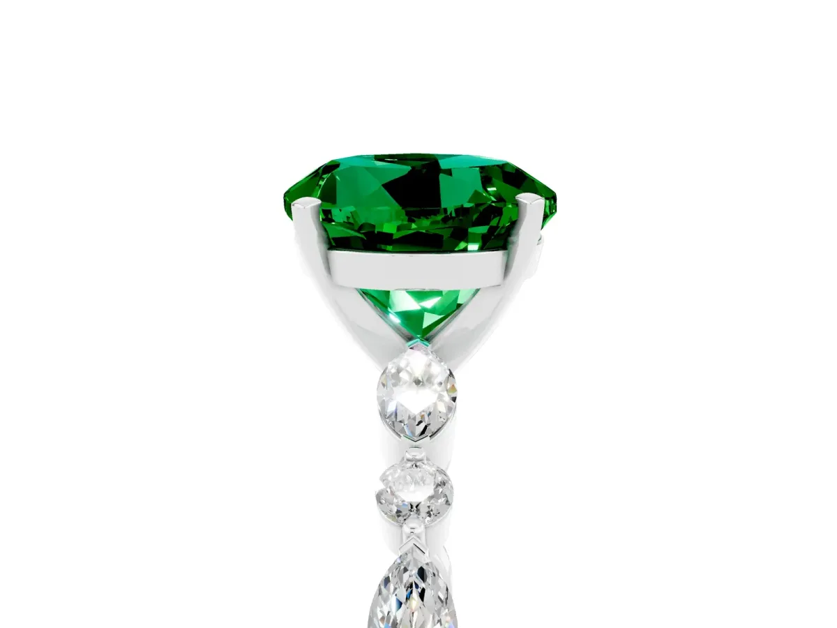 Round Cut Emerald Ring with Marquise and Round Side Stones and Four-Prong Setting Silver