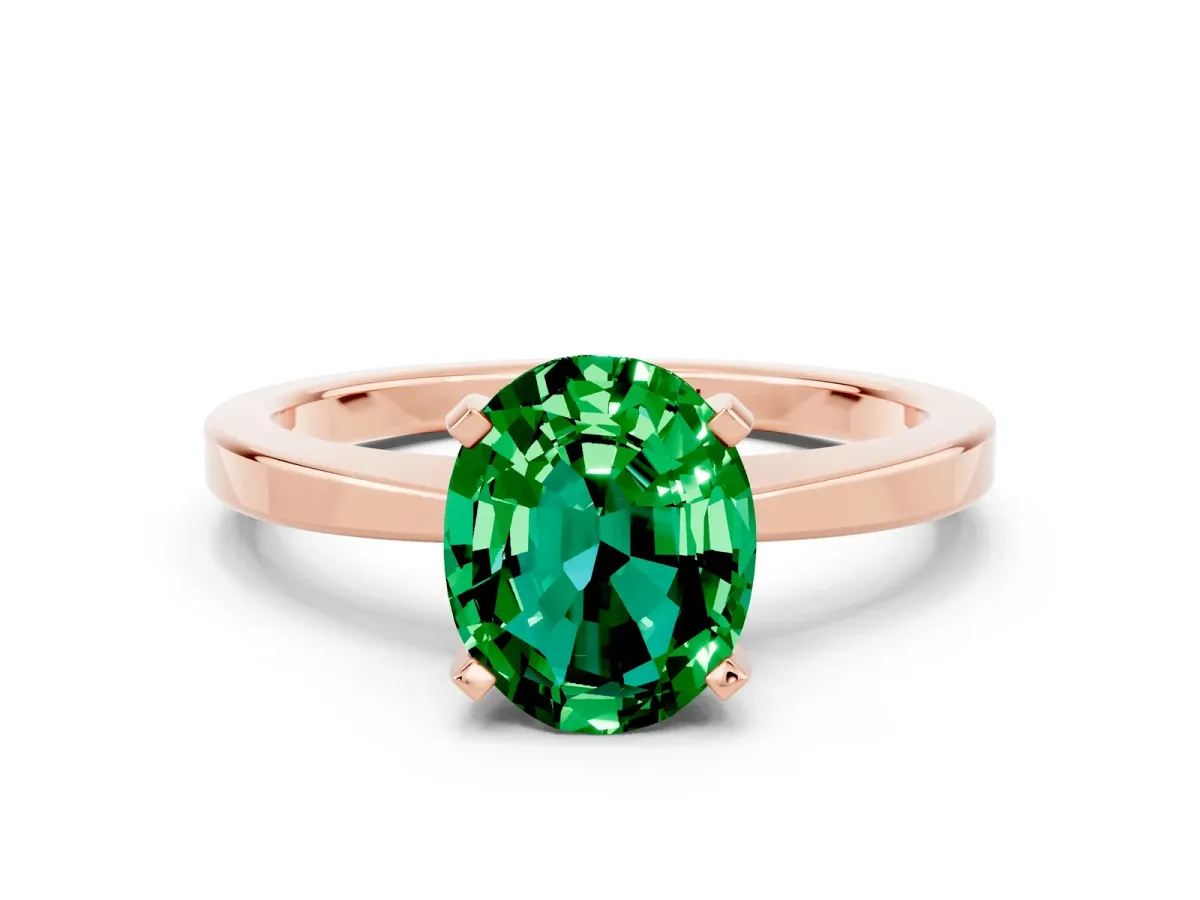 Oval Cut Emerald Solitaire Engagement Ring with Classic Band and Four-Prong Setting Rose gold