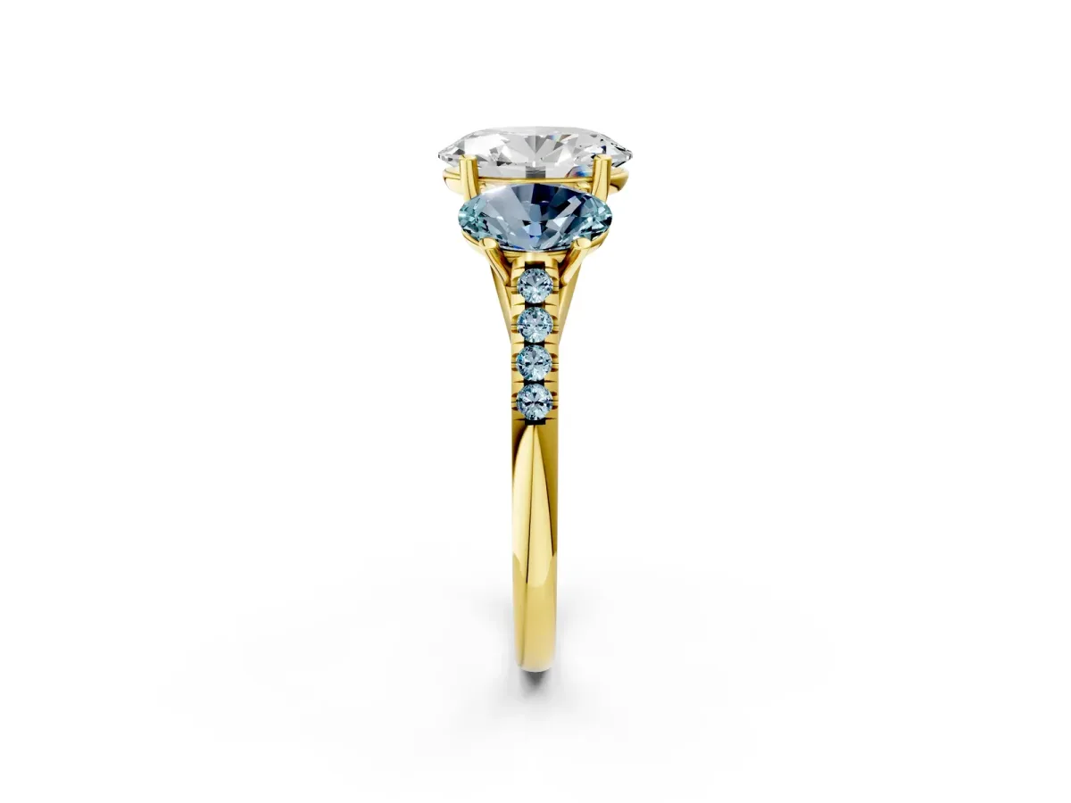 Three-Stone Oval Cut Diamond Ring with Round Aquamarine Pavé Band and Prong Setting Yellow gold