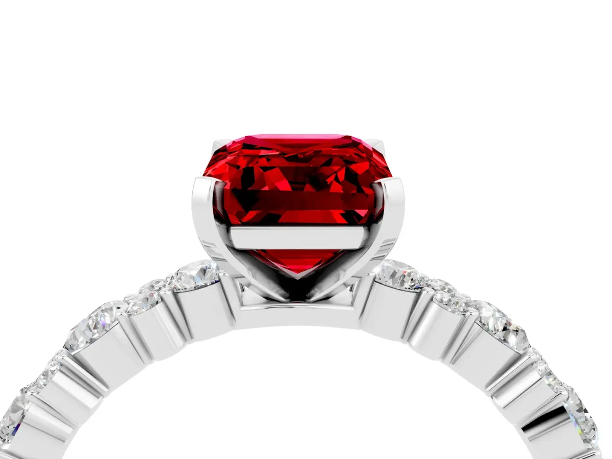 Emerald Cut Ruby Side Stone Solitaire Ring with Round and Four-Prong Setting White gold