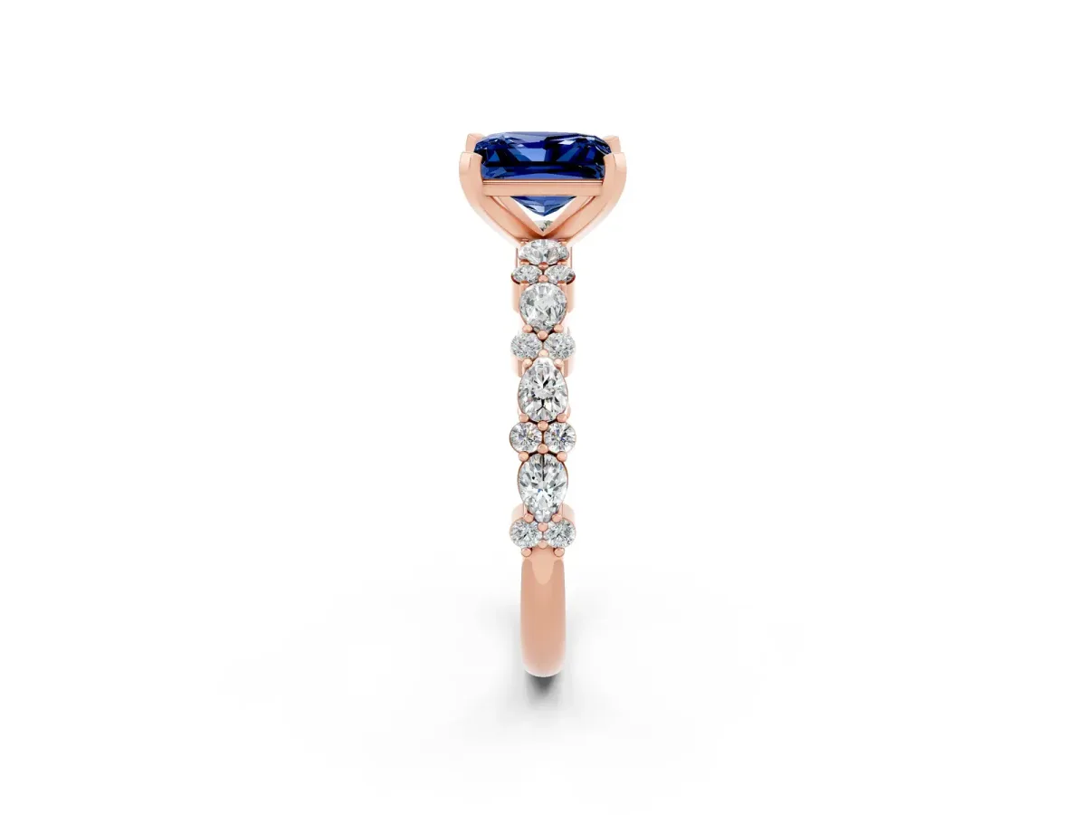 Princess Cut Blue Sapphire Side Stone Solitaire Ring with Round and Four-Prong Setting Rose gold
