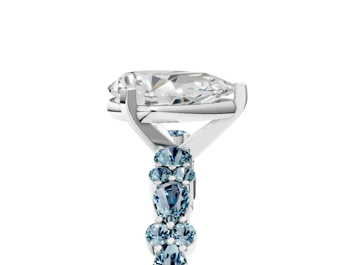 Pear Cut Diamond Side Stone Solitaire Ring with Round Aquamarine and Four-Prong Setting White gold