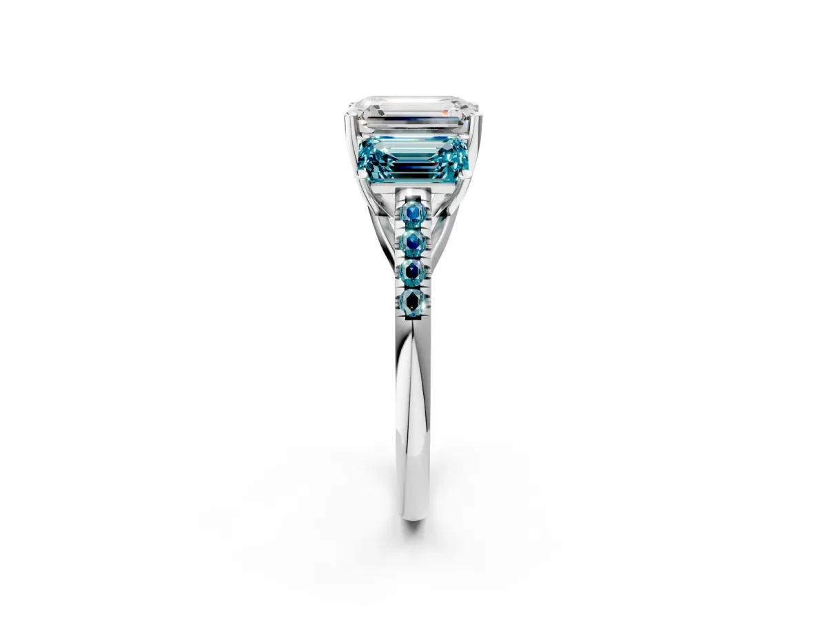 Three-Stone Emerald Cut Diamond Ring with Round Blue Topaz Pavé Band and Prong Setting Platinum