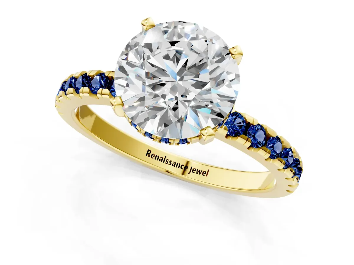 Round Cut Diamond Solitaire Ring with Round Blue Sapphire Pavé Band and Four-Prong Setting Yellow gold