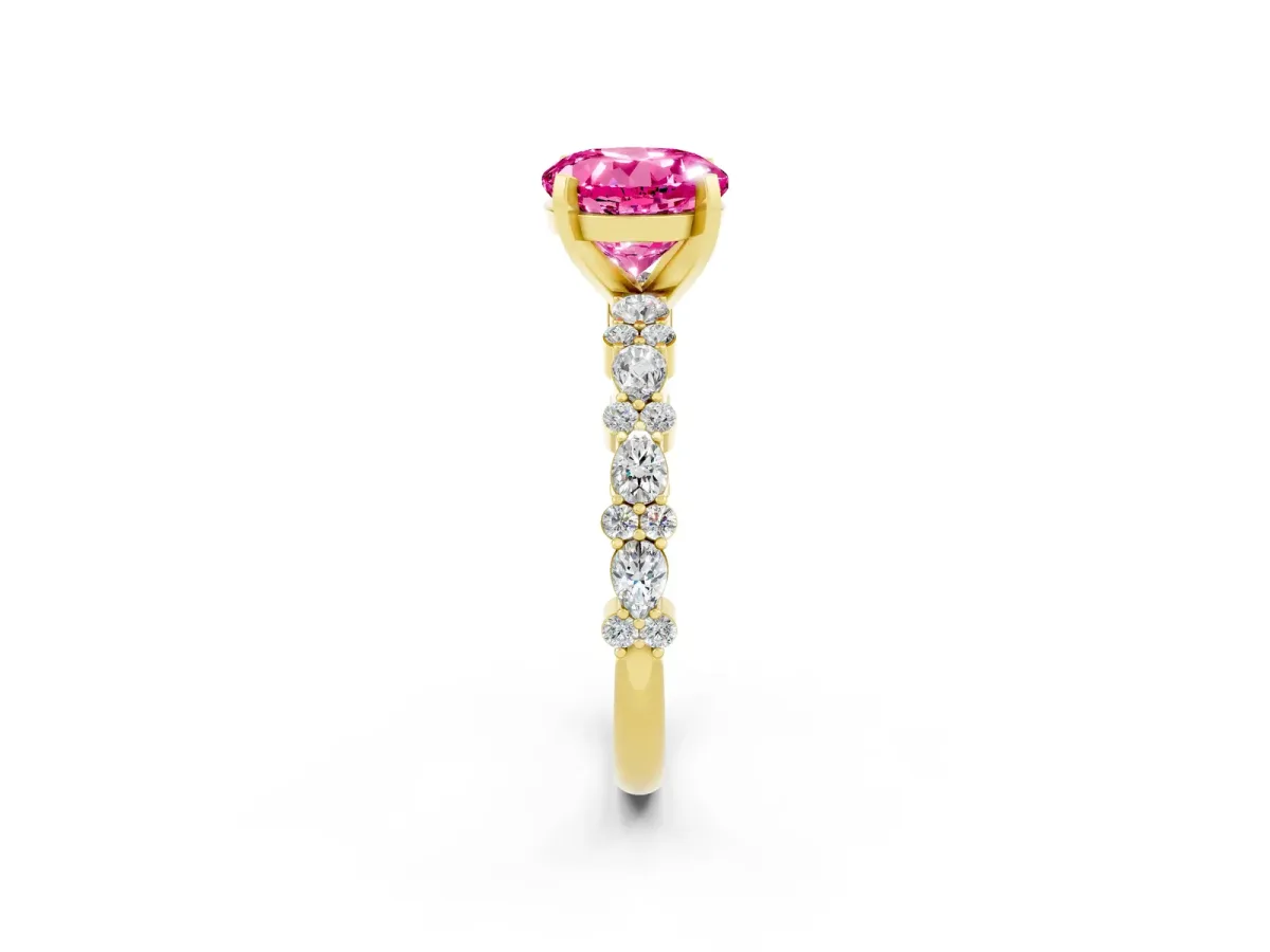 Round Cut Pink Sapphire Side Stone Solitaire Ring with Round and Four-Prong Setting Yellow gold