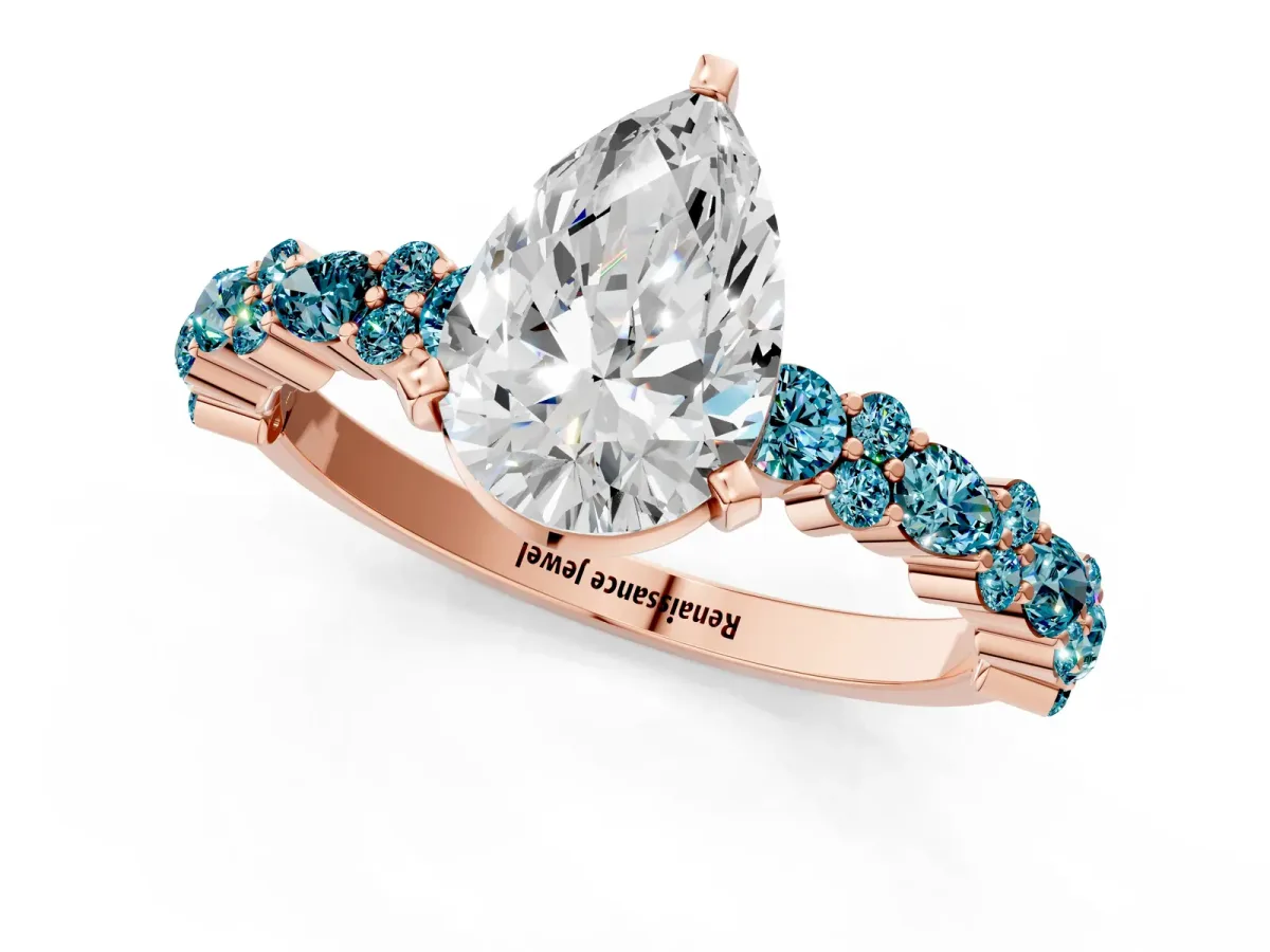 Pear Cut Diamond Side Stone Solitaire Ring with Round Blue Topaz and Four-Prong Setting Rose gold