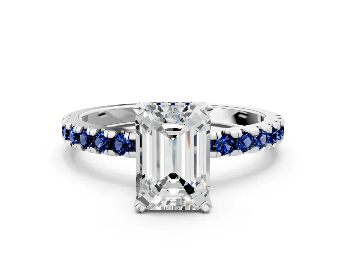 Emerald Cut Diamond Solitaire Ring with Round Blue Sapphire Pavé Band and Four-Prong Setting Silver
