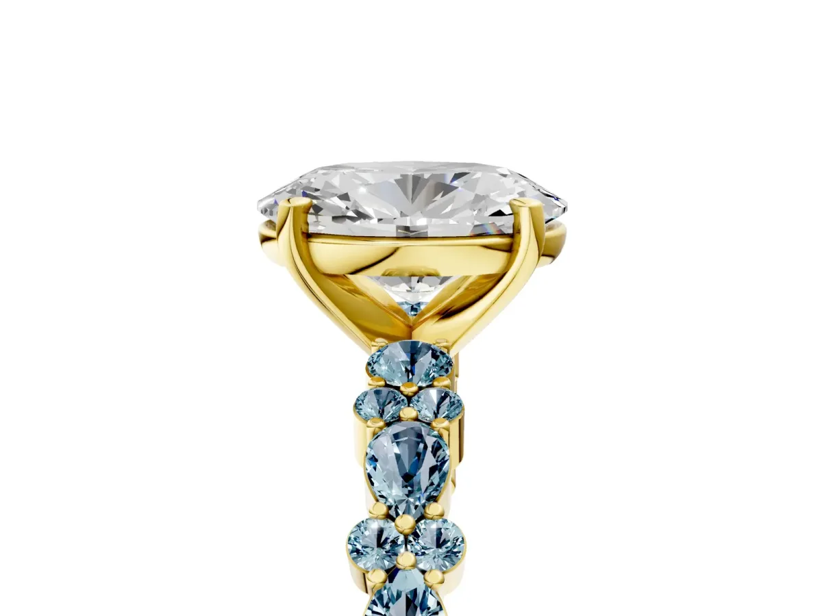 Oval Cut Diamond Side Stone Solitaire Ring with Round Aquamarine and Four-Prong Setting Yellow gold