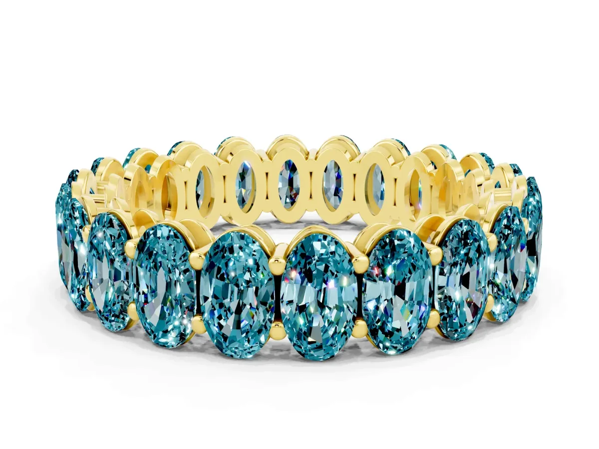 Oval Cut Blue Topaz Eternity Band with Shared Prong Setting Yellow gold