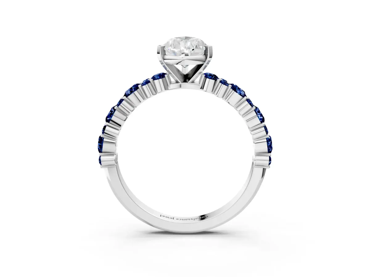 Pear Cut Diamond Side Stone Solitaire Ring with Round Blue Sapphire and Four-Prong Setting Platinum