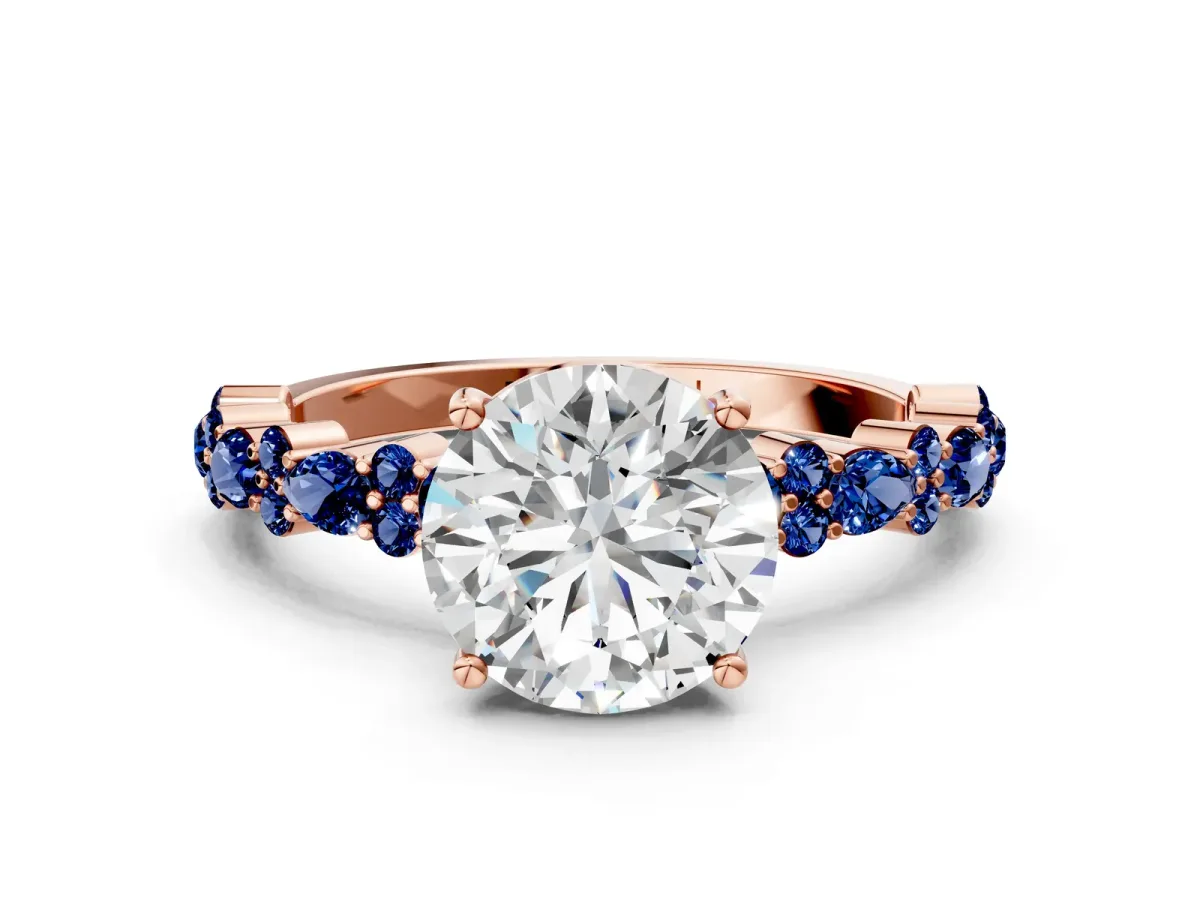 Round Cut Diamond Side Stone Solitaire Ring with Round Blue Sapphire and Four-Prong Setting Rose gold