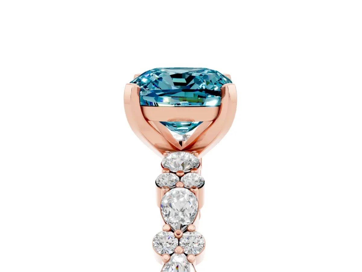 Cushion Cut Blue Topaz Side Stone Solitaire Ring with Round and Four-Prong Setting Rose gold