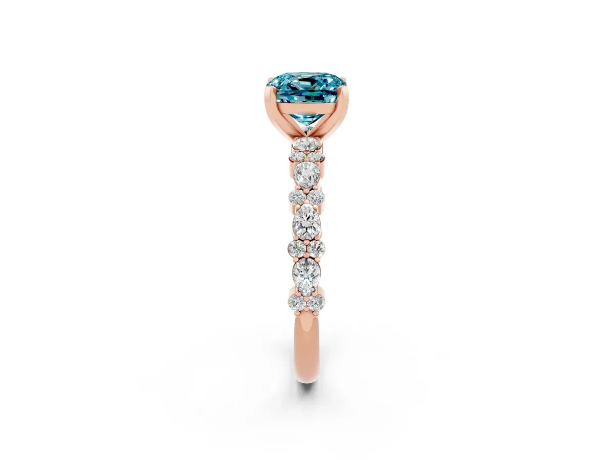 Cushion Cut Blue Topaz Side Stone Solitaire Ring with Round and Four-Prong Setting Rose gold