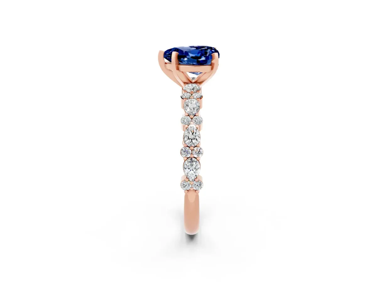 Heart Cut Blue Sapphire Side Stone Solitaire Ring with Round and Four-Prong Setting Rose gold
