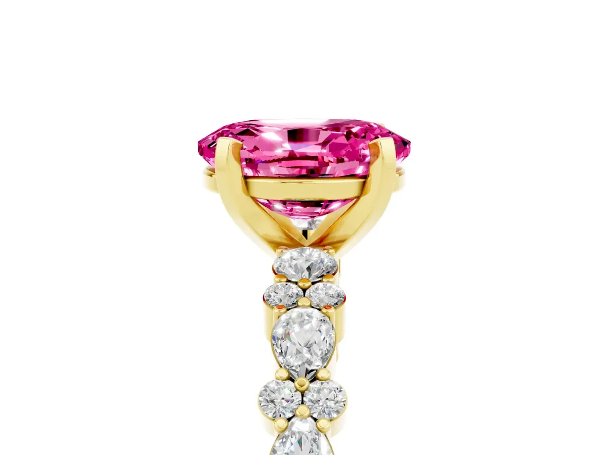 Oval Cut Pink Sapphire Side Stone Solitaire Ring with Round and Four-Prong Setting Yellow gold