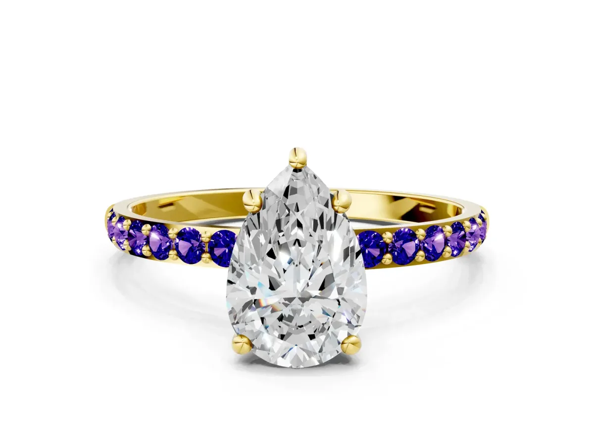 Pear Cut Diamond Solitaire Ring with Round Tanzanite Pavé Band and Prong Setting Yellow gold