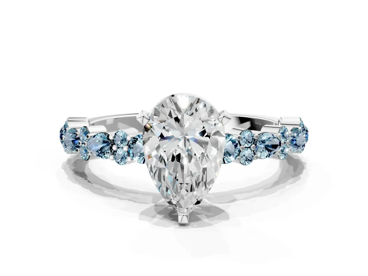Pear Cut Diamond Side Stone Solitaire Ring with Round Aquamarine and Four-Prong Setting White gold