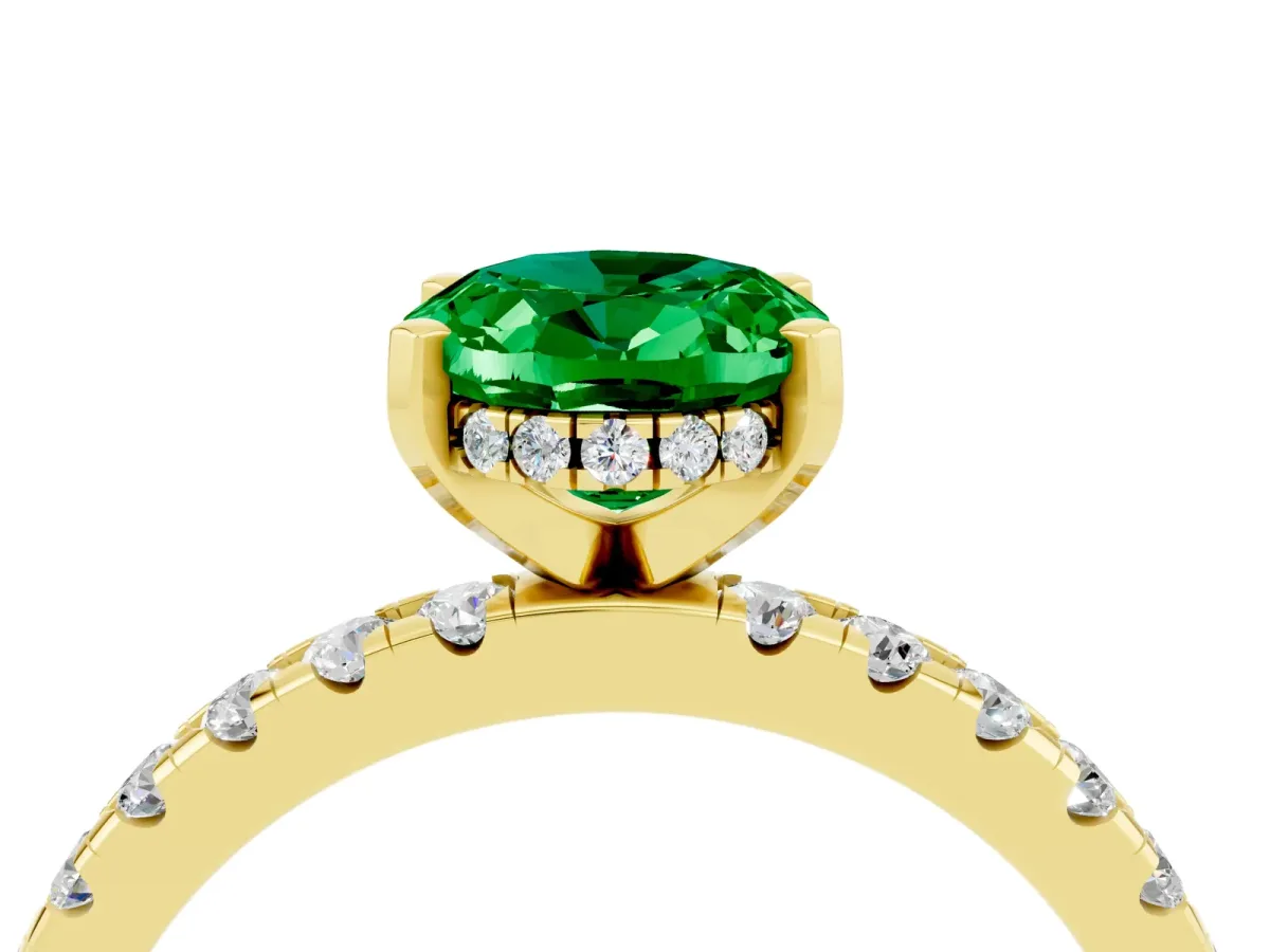 Oval Cut Emerald Solitaire Ring with Round Pavé Band and Four-Prong Setting Yellow gold