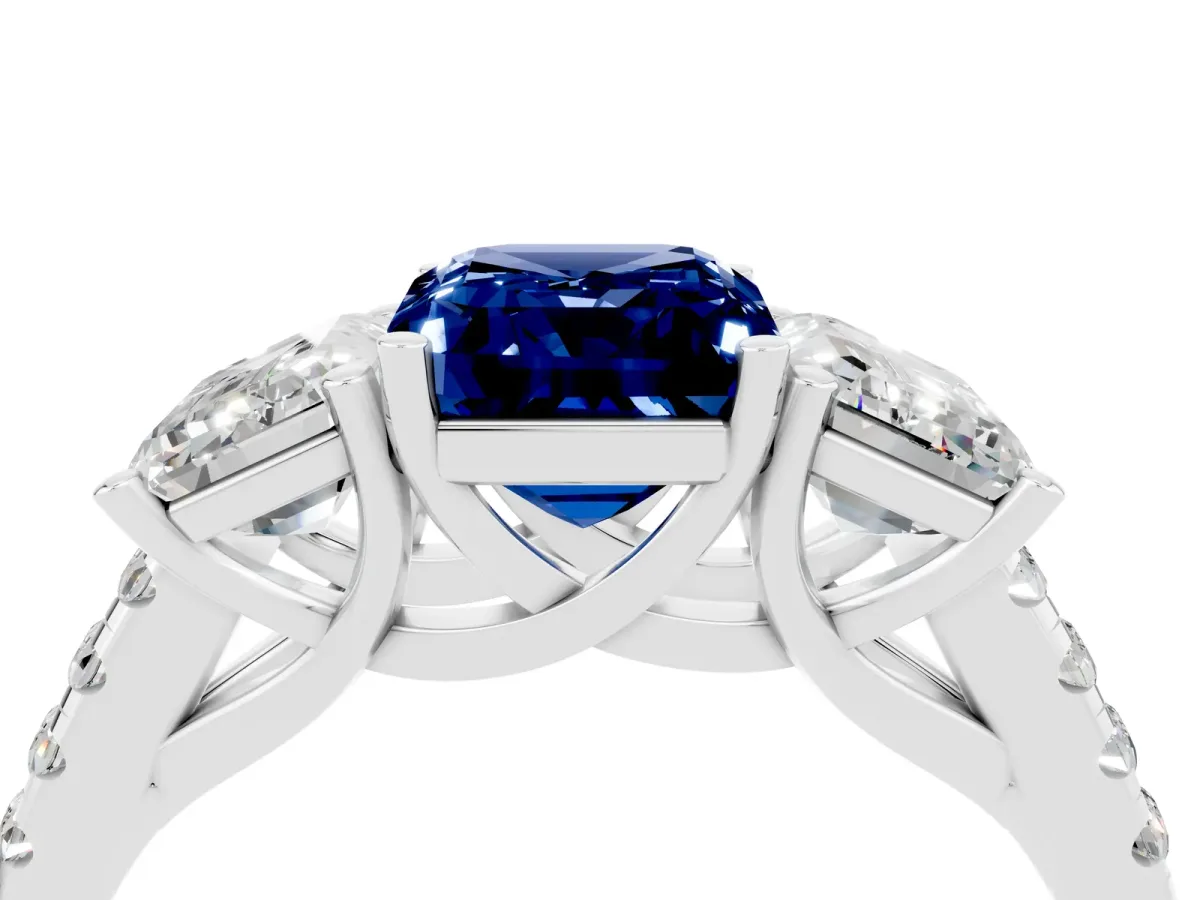 Three-Stone Emerald Cut Blue Sapphire Ring with Round Pavé Band and Prong Setting Platinum