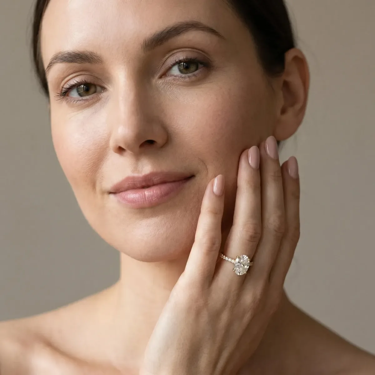 Oval Cut Diamond Solitaire Ring with Round Pavé Band and Prong Setting Yellow gold