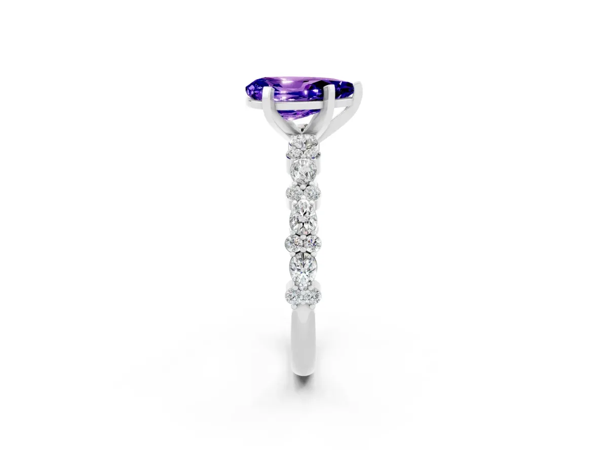 Pear Cut Tanzanite Side Stone Solitaire Ring with Round and Four-Prong Setting Silver