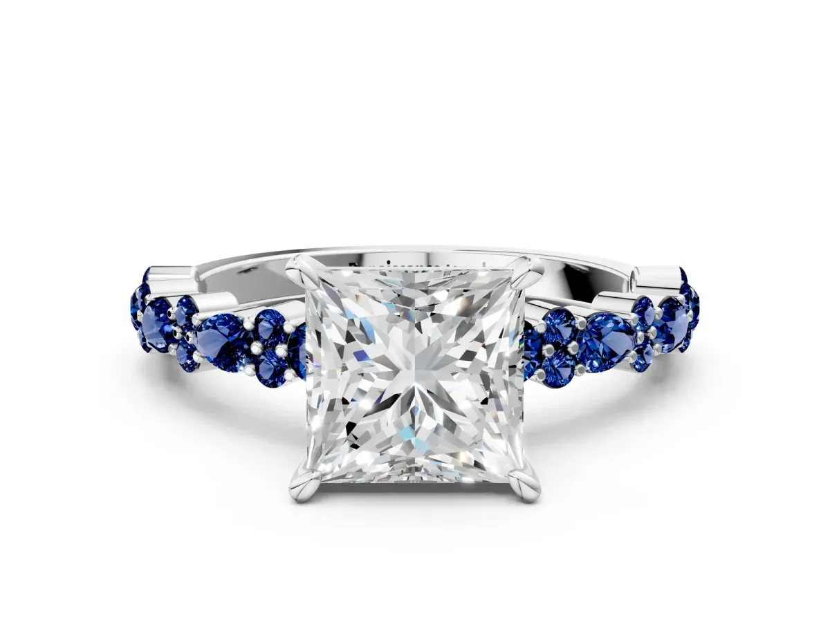 Princess Cut Diamond Side Stone Solitaire Ring with Round Blue Sapphire and Four-Prong Setting Platinum