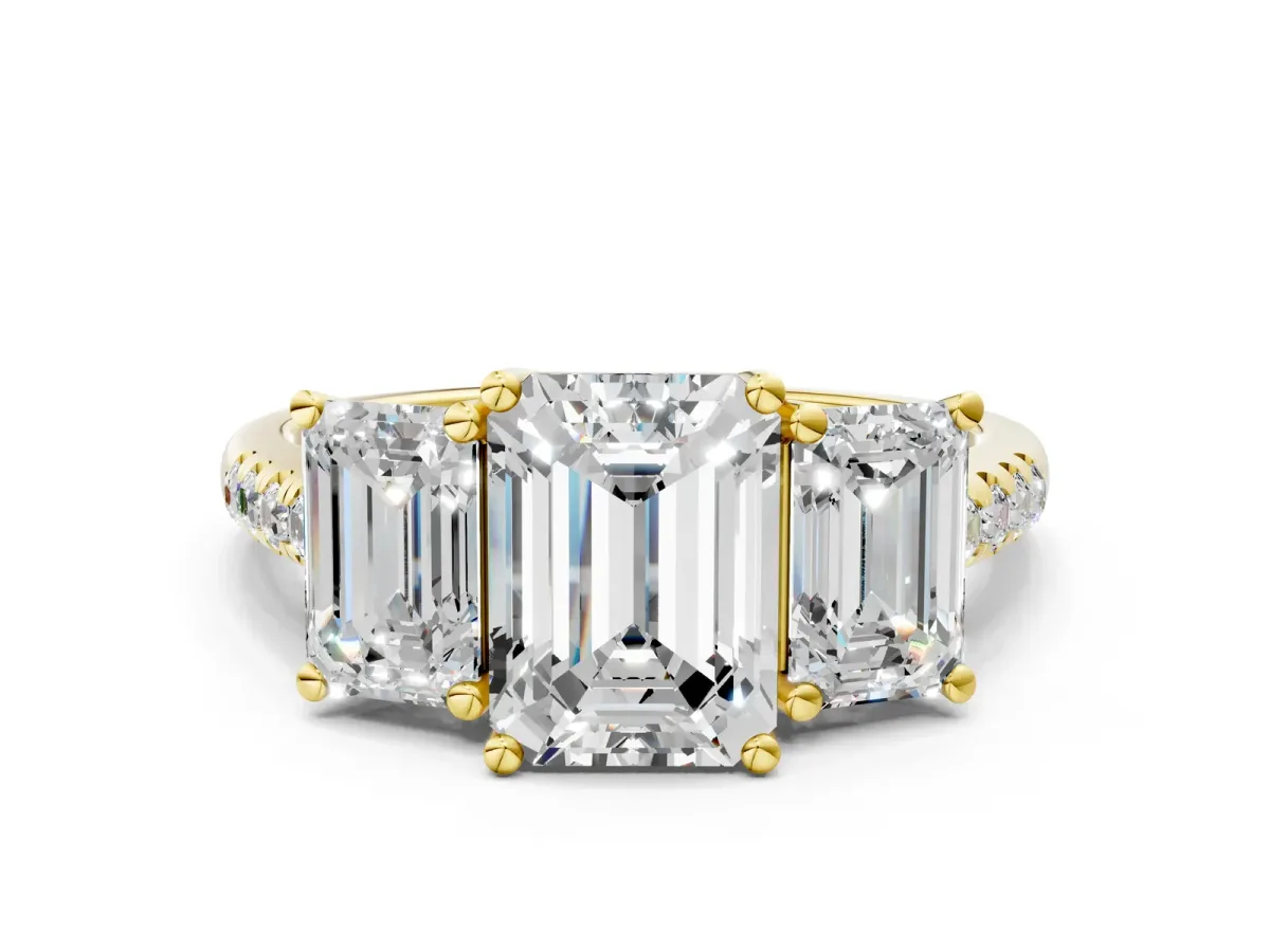 Three-Stone Emerald Cut Diamond Ring with Round Moissanite Pavé Band and Prong Setting Yellow gold