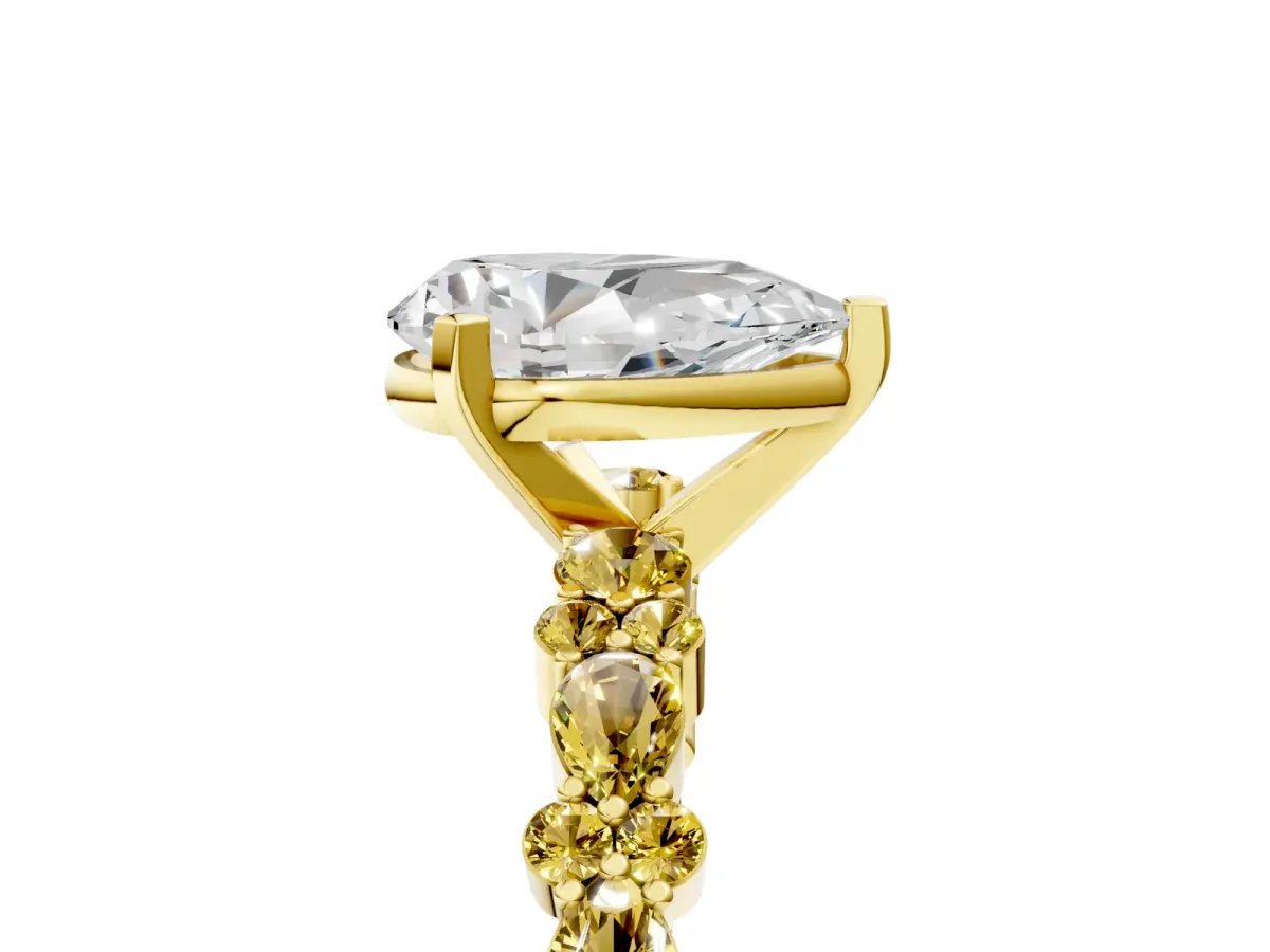 Pear Cut Diamond Side Stone Solitaire Ring with Round Yellow Sapphire and Four-Prong Setting Yellow gold