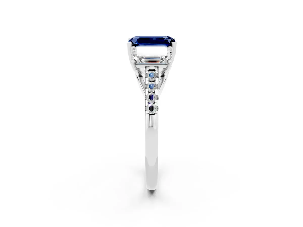 Three-Stone Emerald Cut Blue Sapphire Ring with Round Pavé Band and Prong Setting Platinum