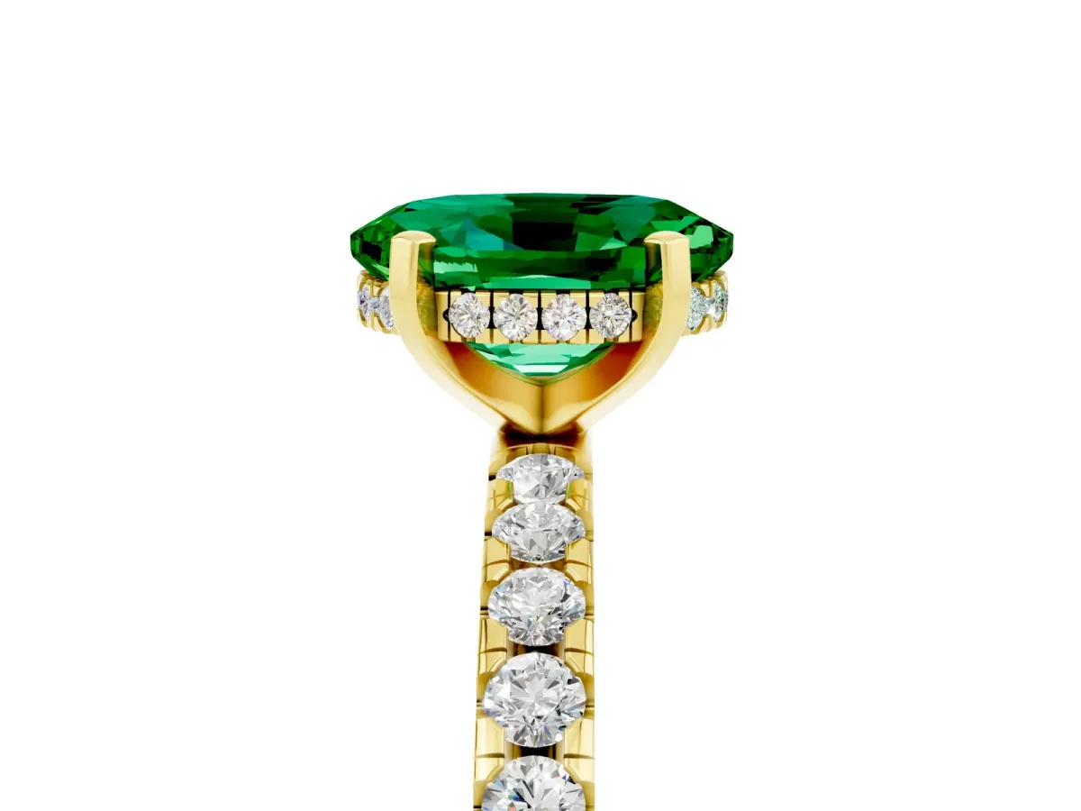 Oval Cut Emerald Solitaire Ring with Round Pavé Band and Four-Prong Setting Yellow gold