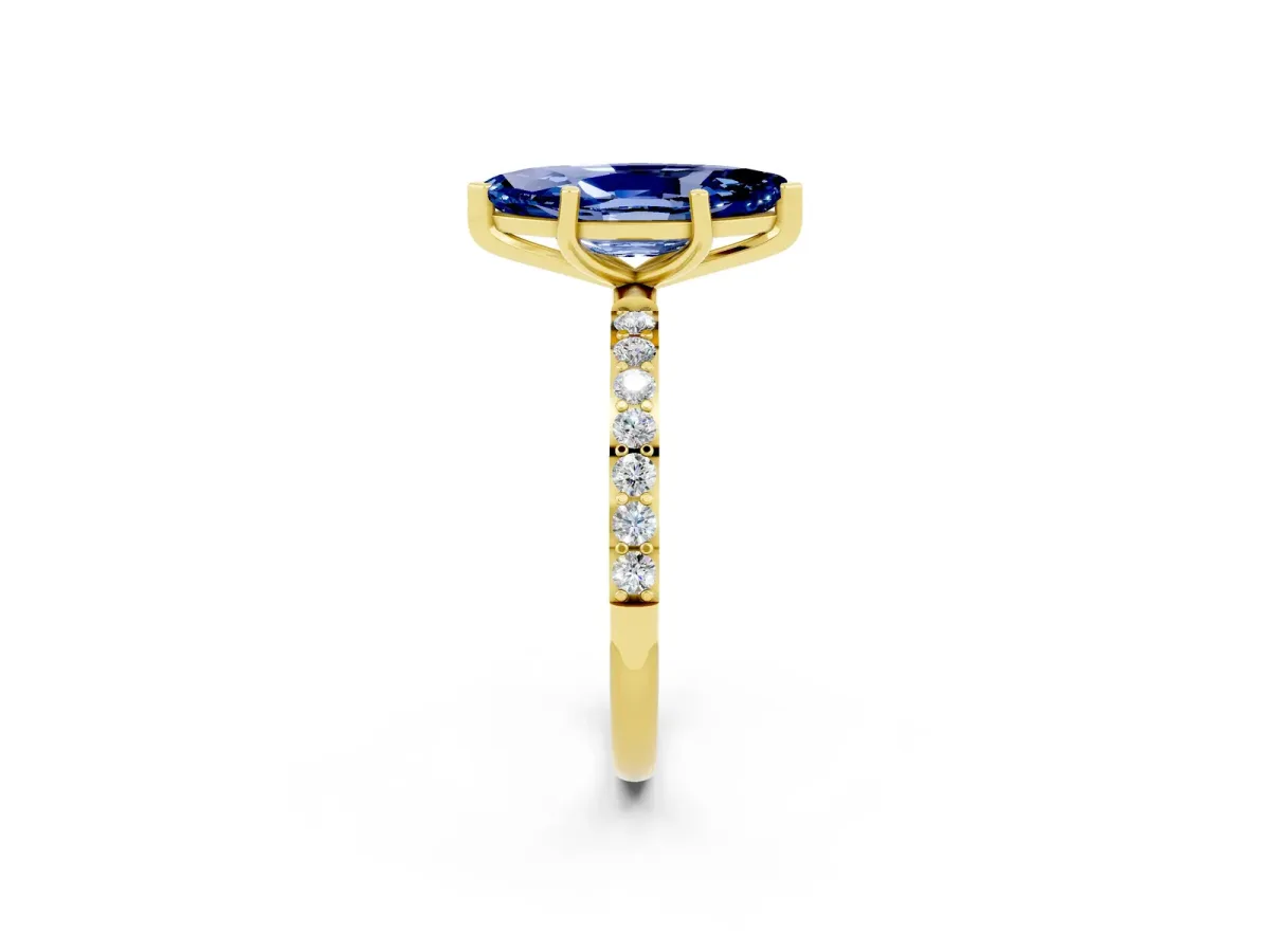 Marquise Cut Blue Sapphire Solitaire Ring with Round Pavé Band and Prong Setting Yellow gold