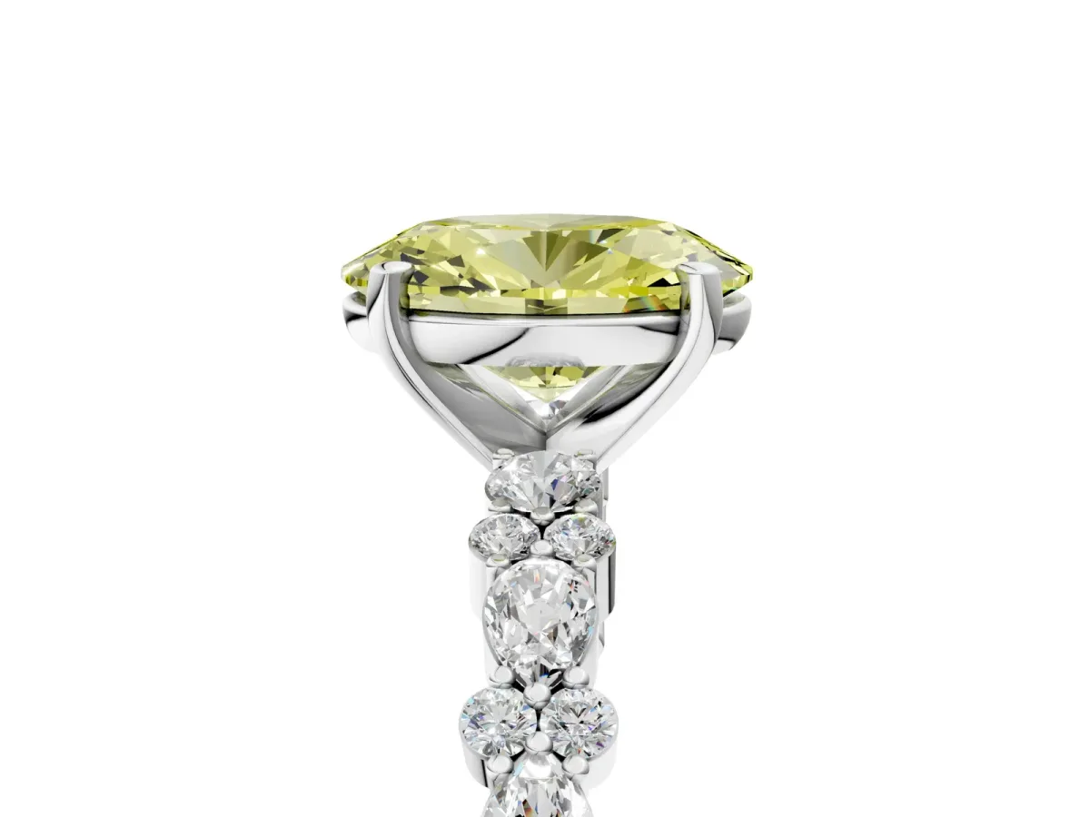 Fancy Yellow Oval Cut Diamond Side Stone Solitaire Ring with Round and Four-Prong Setting Platinum