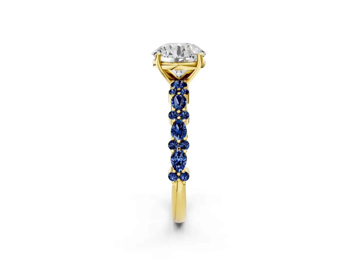 Round Cut Diamond Side Stone Solitaire Ring with Round Blue Sapphire and Four-Prong Setting Yellow gold