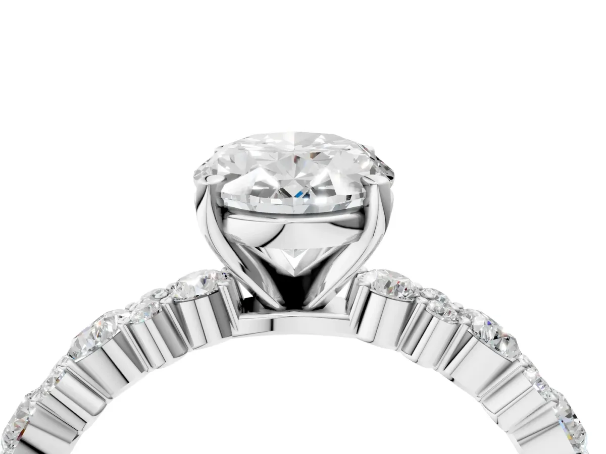 Oval Cut Diamond Side Stone Solitaire Ring with Round Moissanite and Four-Prong Setting White gold