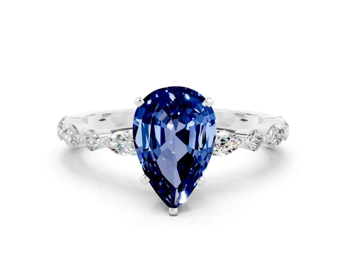 Pear Cut Blue Sapphire Ring with Marquise and Round Side Stones and Four-Prong Setting Silver