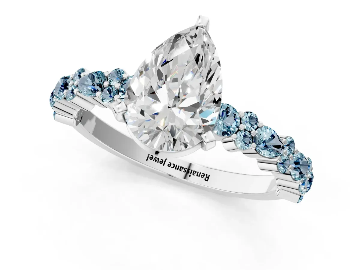 Pear Cut Diamond Side Stone Solitaire Ring with Round Aquamarine and Four-Prong Setting White gold