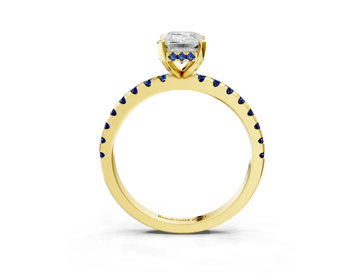 Emerald Cut Diamond Solitaire Ring with Round Blue Sapphire Pavé Band and Four-Prong Setting Yellow gold