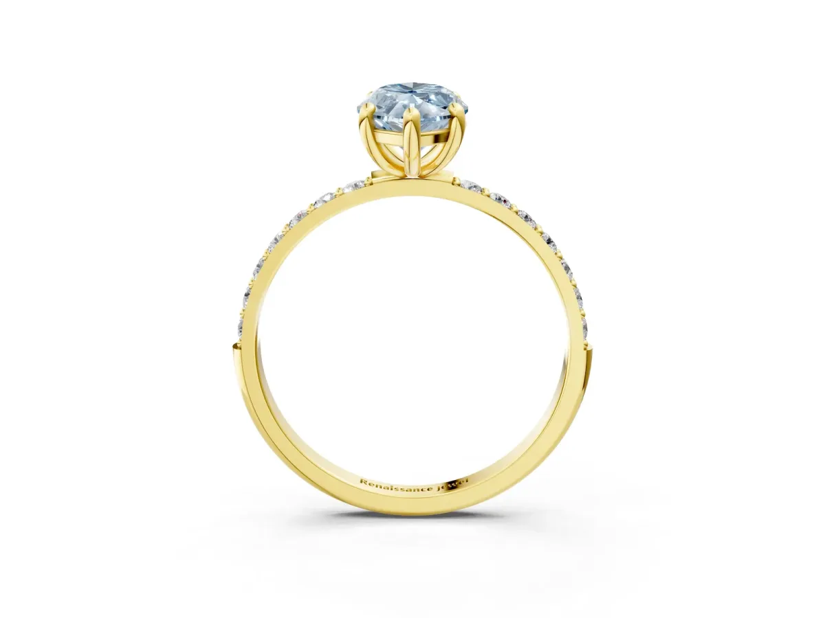 Fancy Blue Marquise Cut Diamond Solitaire Ring with Round Pavé Band and Prong Setting Yellow gold