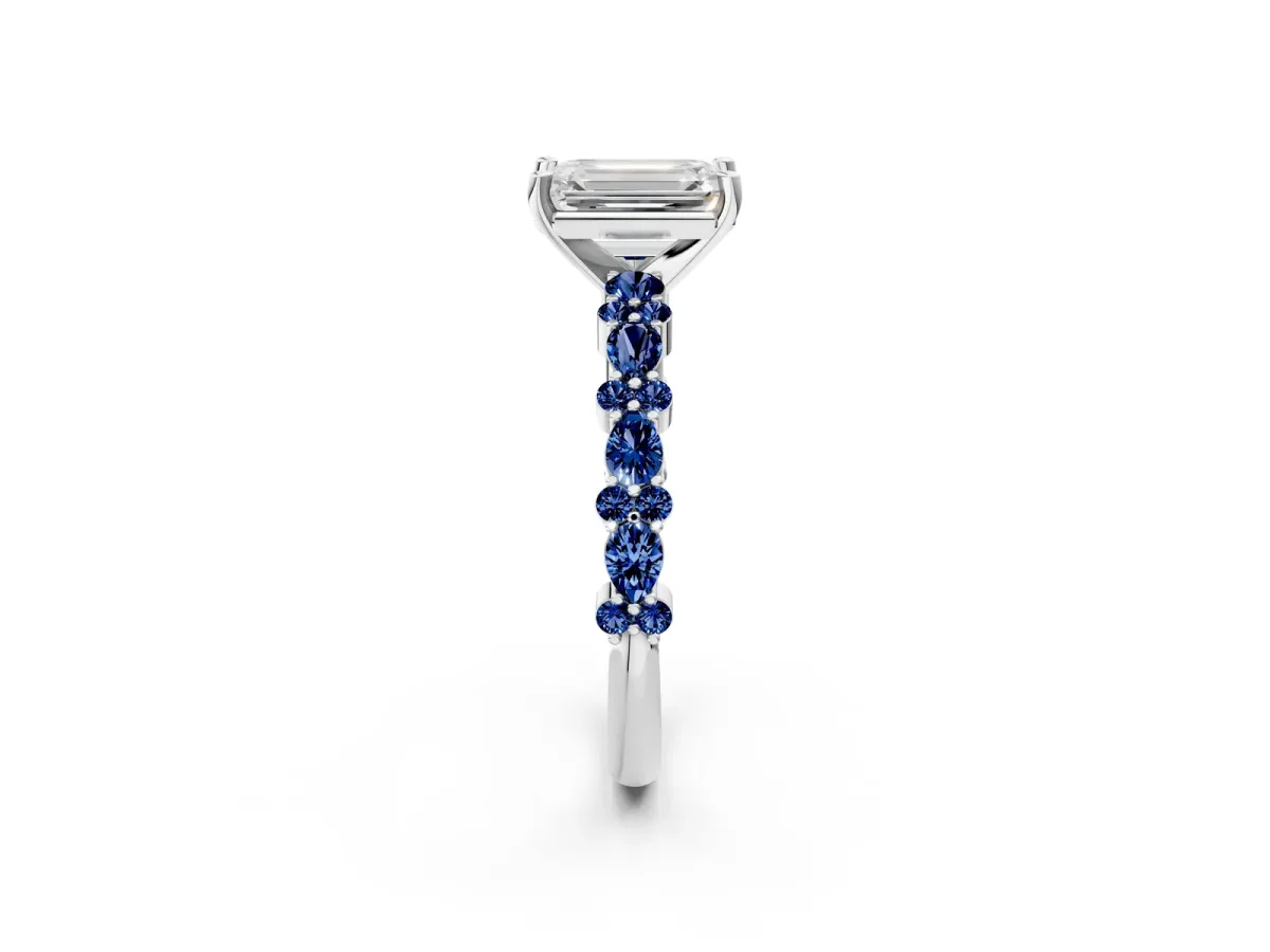 Emerald Cut Diamond Side Stone Solitaire Ring with Round Blue Sapphire and Four-Prong Setting Silver