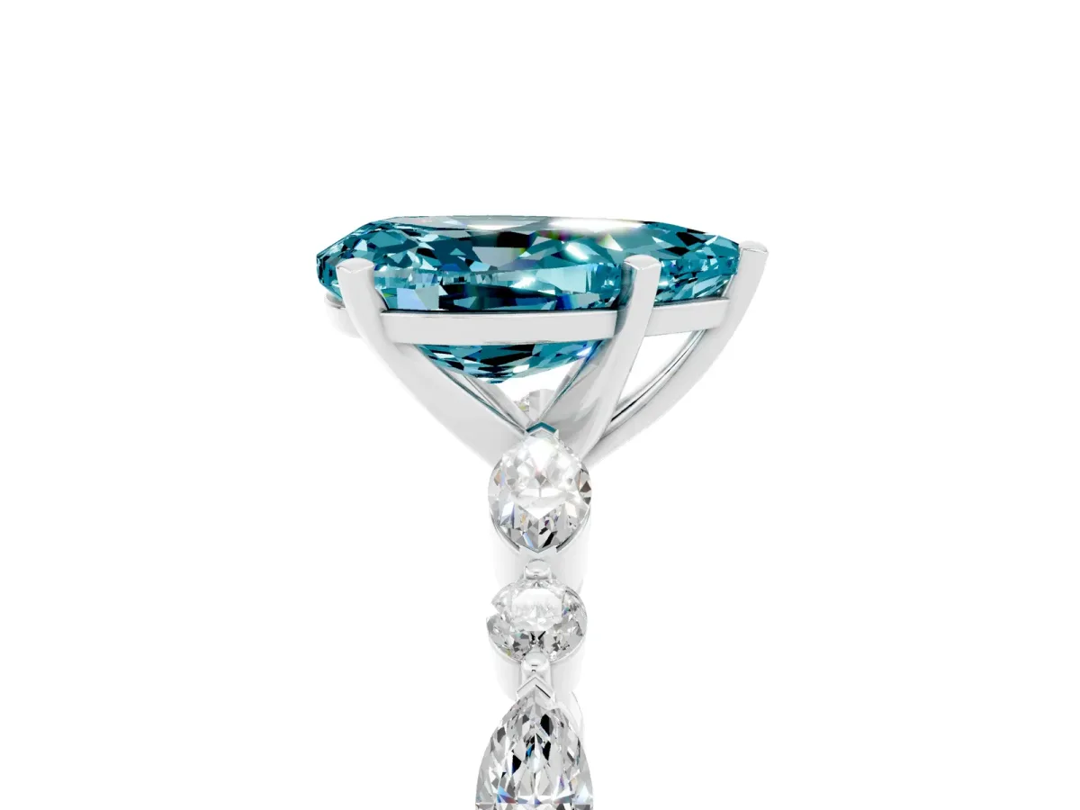 Pear Cut Blue Topaz Ring with Marquise and Round Side Stones and Four-Prong Setting Platinum
